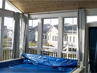 <b>Another view of the interior of the screened porch.</b>